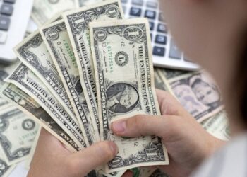 Dollar stalls as dovish Fed tone dials down rate expectations