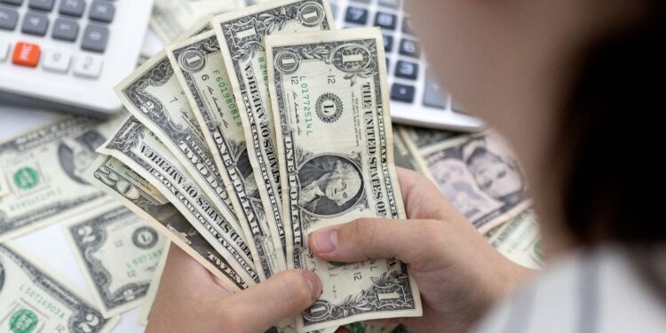 Dollar stalls as dovish Fed tone dials down rate expectations