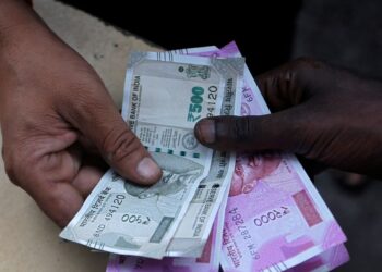 Rupee to rise slightly ahead of RBI decision, key US labour data