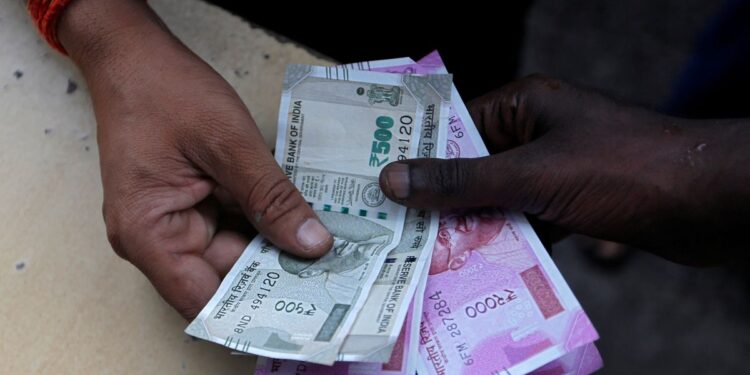 Rupee to rise slightly ahead of RBI decision, key US labour data