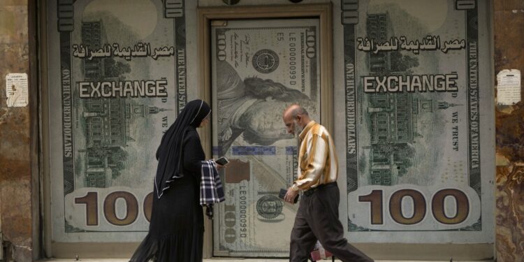 Egypt floats its currency and agrees with the IMF to increase a bailout loan to $8 billion