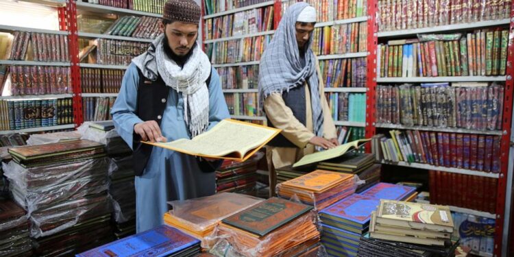 Phones, Islamic books and currency exchange. Some businesses are making money out of Taliban rule