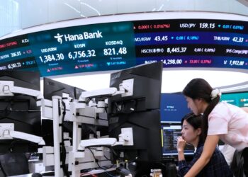 Asian shares mostly rise as oil prices fall and hope grows for AI