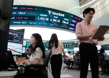 Oil prices gain and Asian shares are mixed after a rally on Wall Street