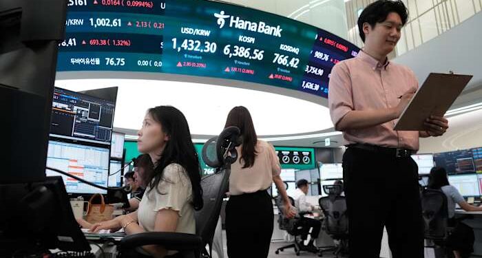 Oil prices gain and Asian shares are mixed after a rally on Wall Street