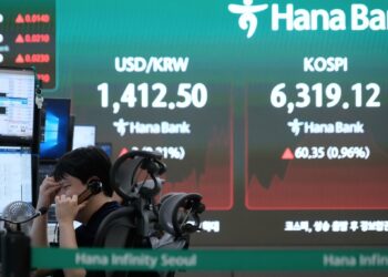 Asian shares are mixed after gains on Wall Street, while oil prices climb