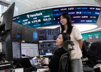 Asian shares fall and oil prices hold steady above $100 a barrel